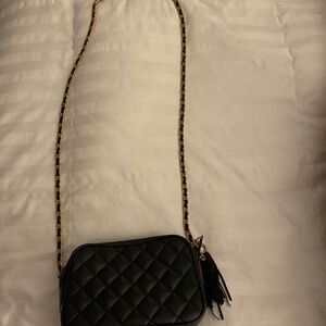 Black quilted crossbody purse Bloomingdales with chain handle and tassel